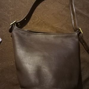 Brown thick leather coach purse or bag.